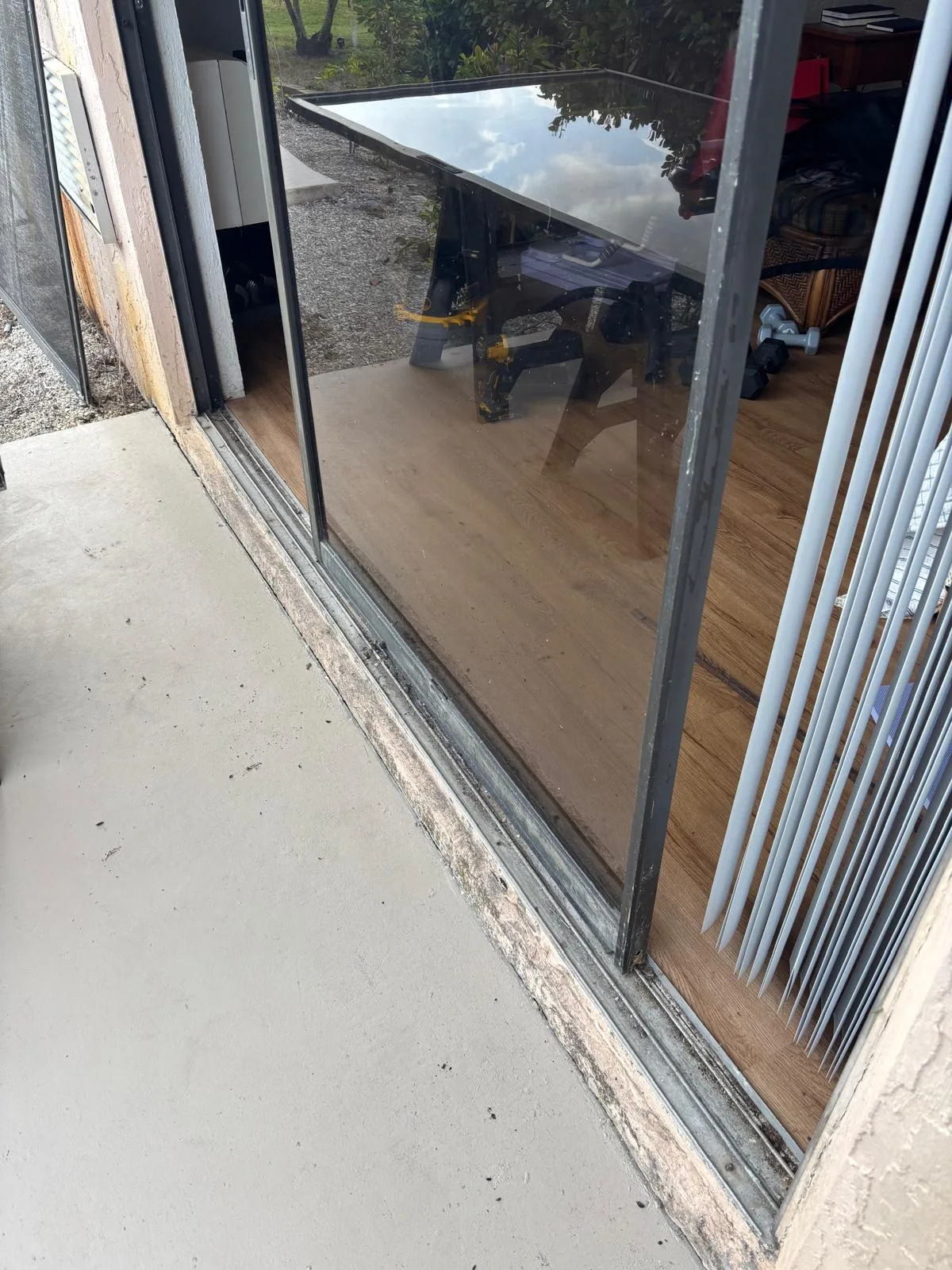 Old sliding glass door needing lock repair