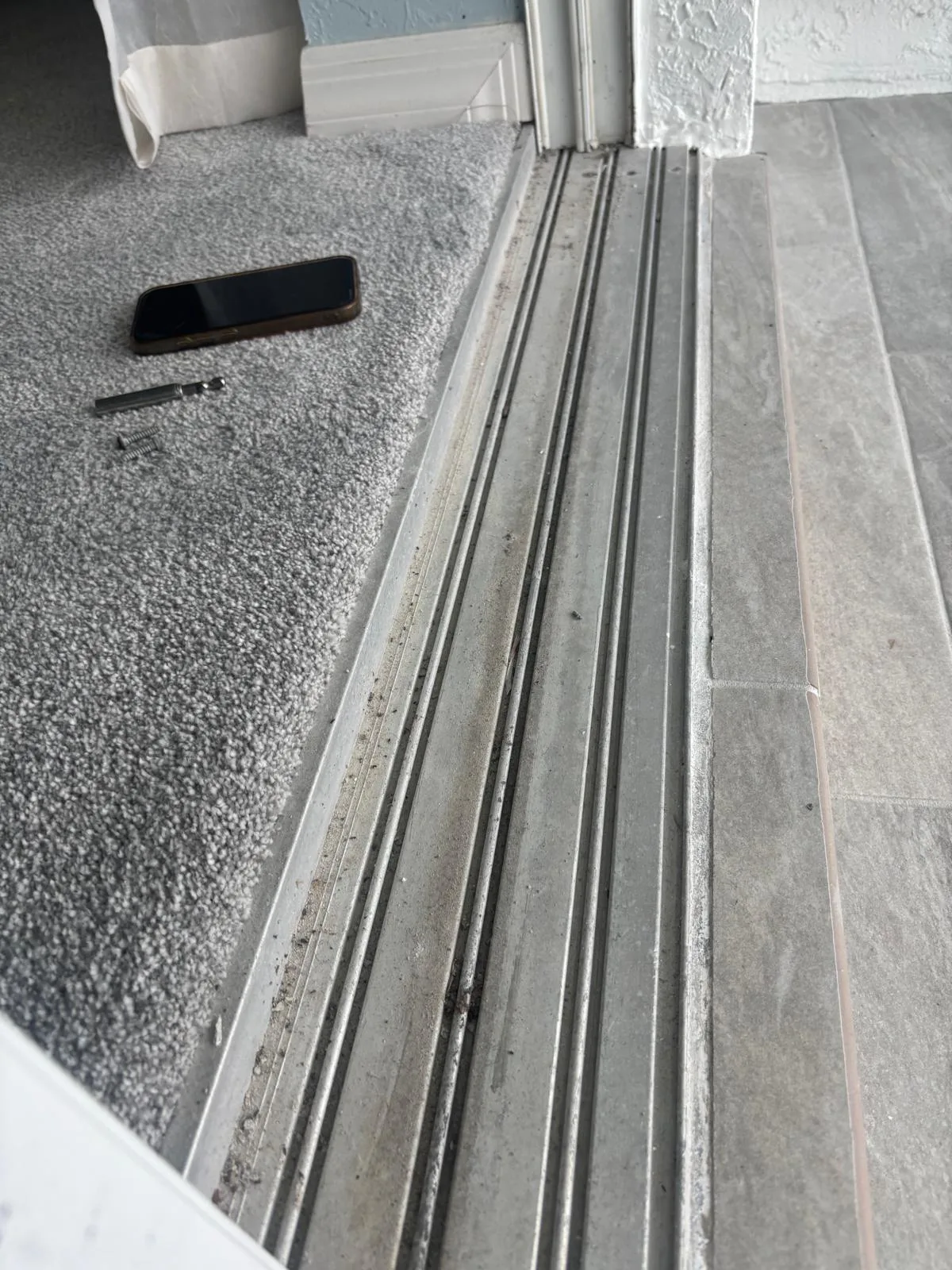 Sliding door track cleaned and repaired